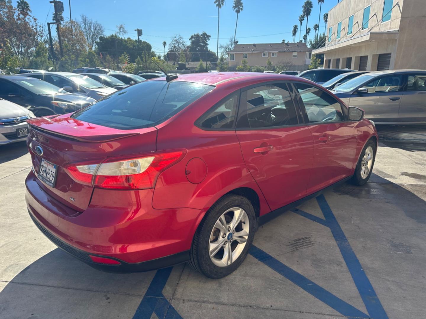 2012 RED /BLACK Ford Focus SE Sedan (1FAHP3F29CL) with an 2.0L L4 DOHC 16V engine, AUTOMATIC transmission, located at 30 S. Berkeley Avenue, Pasadena, CA, 91107, (626) 248-7567, 34.145447, -118.109398 - New Tires! Nice Interior! drives and looks good! Bad credit? We can help! We are the bank. All our cars are thoroughly inspected and reconditioned by our technicians. FREE CARFAX report. Stop by or call to speak with our friendly staff. Whether you have bad credit, no credit, bankruptcy, or reposse - Photo#4